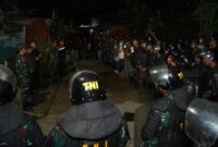 1763507102456-personel-tni-berjaga-di-lokasi-tawuran-kecamatan-tallo-makassar-1763502698241_169