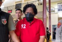 1765602363929-bos-terra-drone-michael-wishnu-wardhana-berbaju-tahanan-usai-ditetapkan-jadi-tersangka-kebakaran-maut-1765526648013_169